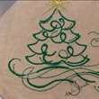 Green Christmas tree embroidery with decorative swirls and star